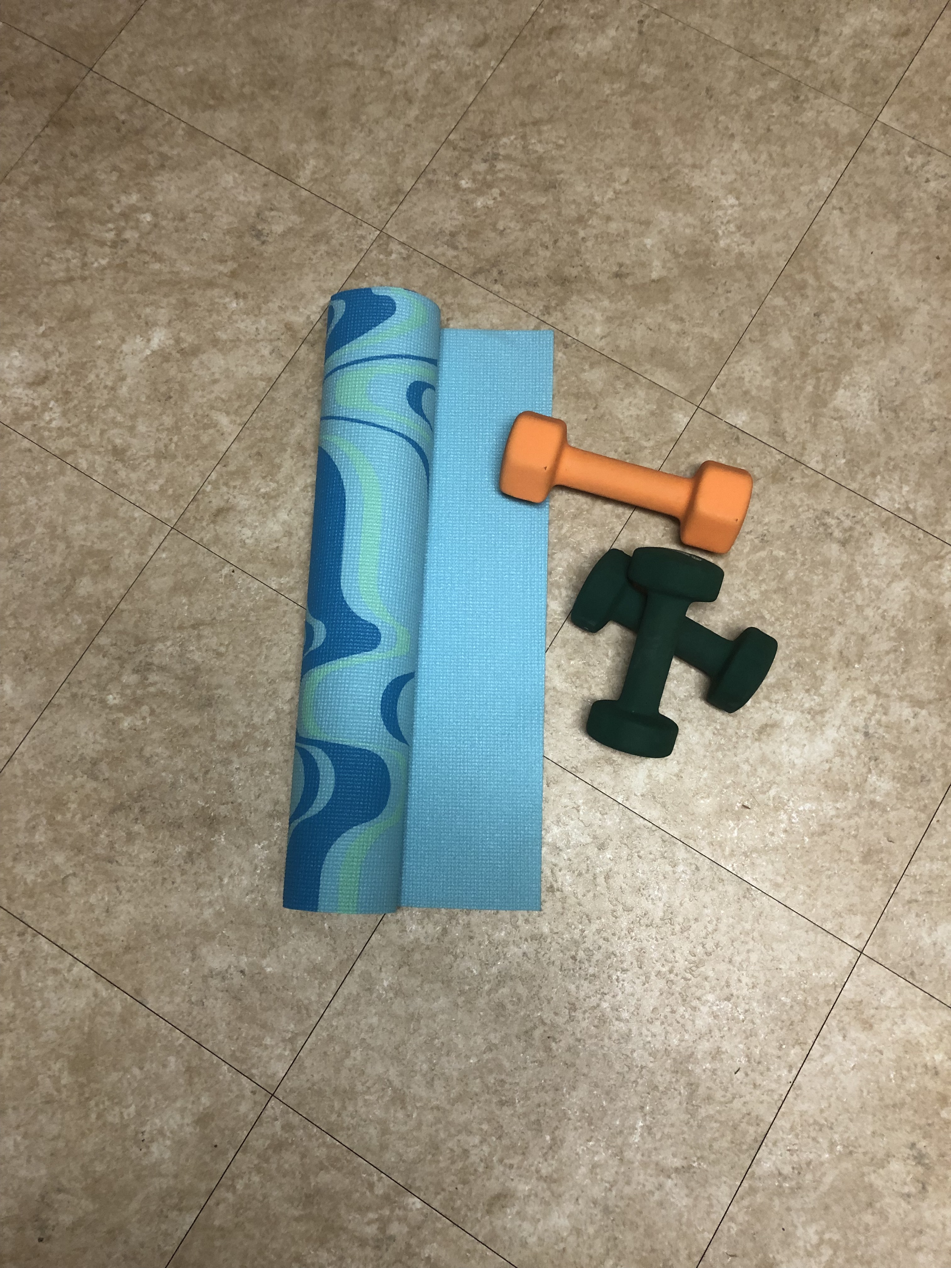 Yoga mat and weights. An invitation to stillness