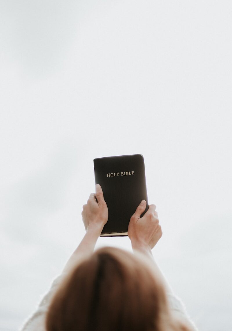 Photo by Priscilla Du Preez 🇨🇦 person holding Holy Bible The Mustard Patch mustardpatch.org
